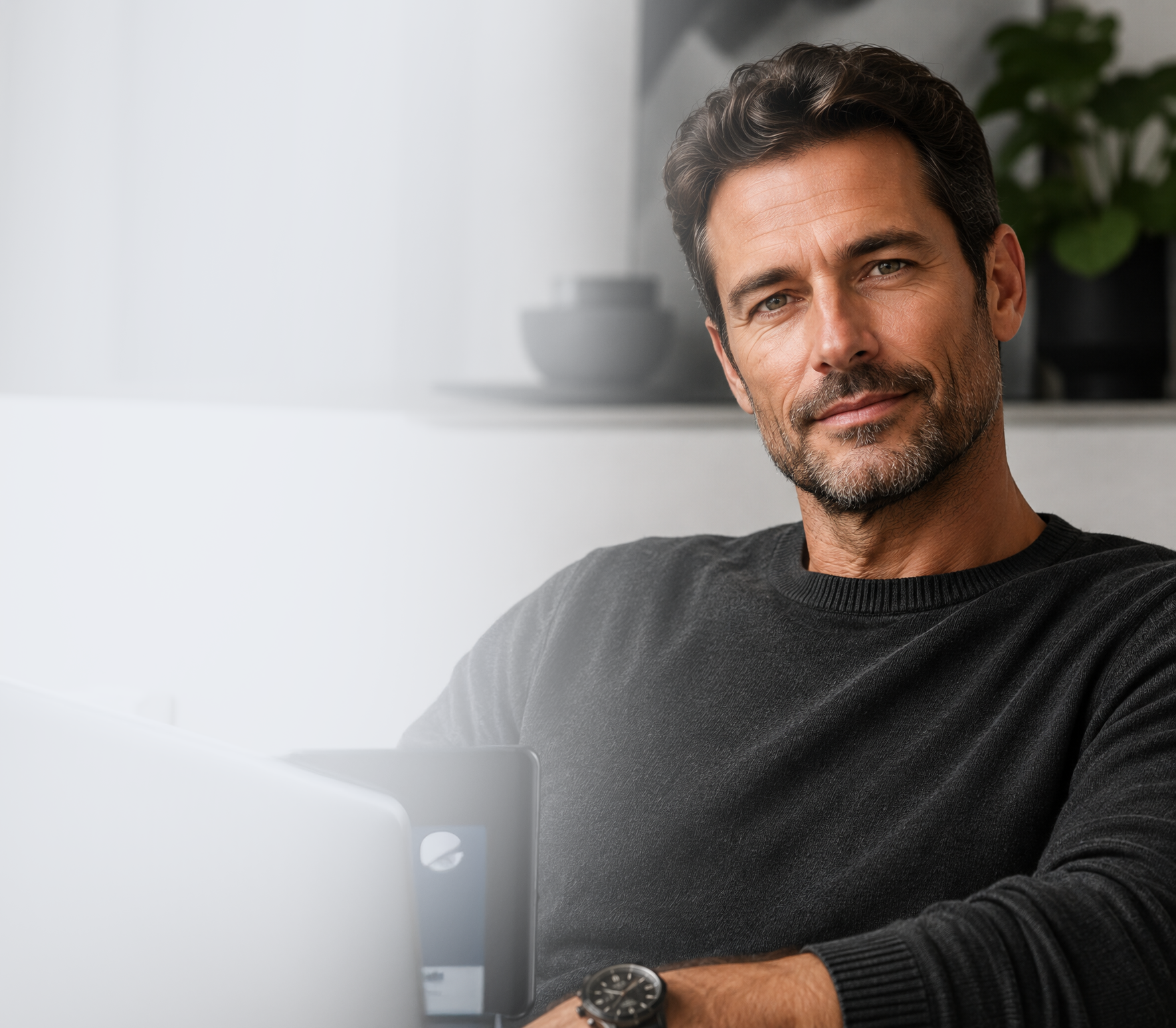 Man relaxing at home with his laptop
